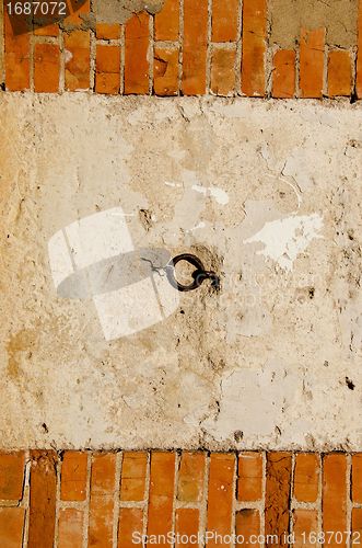Image of Red brick and concrete wall. 