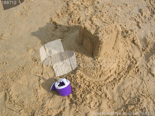 Image of Abandoned Sand Castle & Watering Can