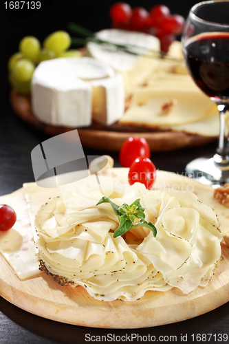 Image of Cheese and salami platter with herbs