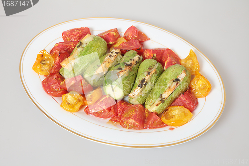 Image of baked tomatoes and stuffed courgettes