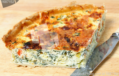 Image of spinach quiche on a board