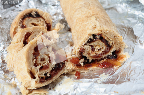 Image of Spotted dick sliced on tinfoil