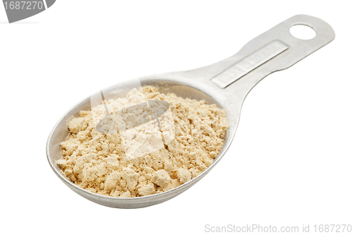 Image of maca root powder on tablespoon