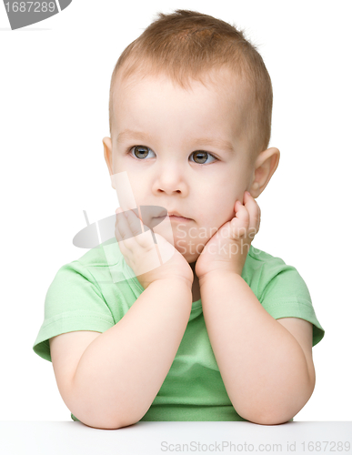 Image of Portrait of a cute and pensive little boy