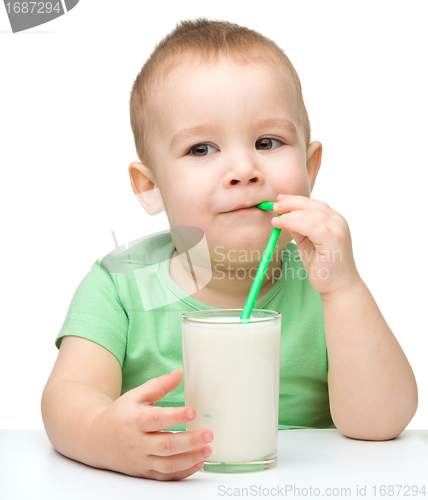 Image of Cute little boy with a glass of milk