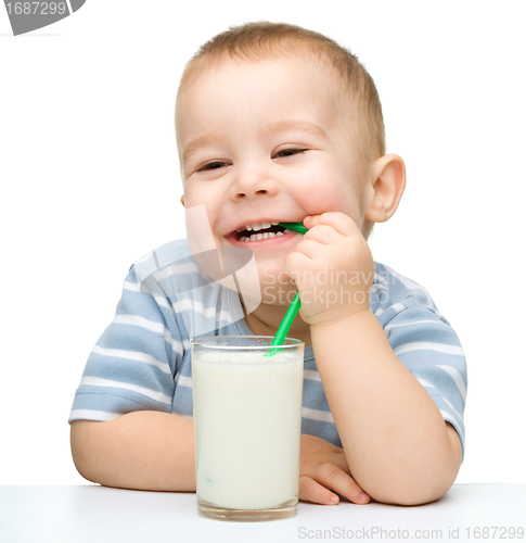 Image of Cute little boy with a glass of milk