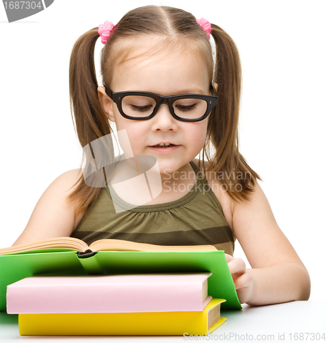 Image of Cute little girl reading book