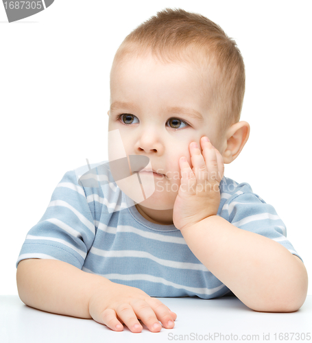 Image of Portrait of a cute and pensive little boy