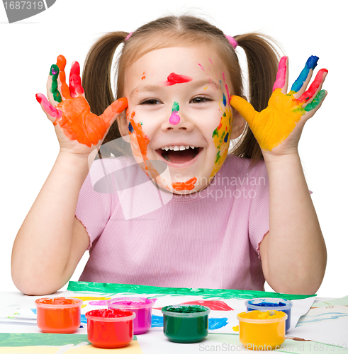 Image of Cheerful girl with painted hands