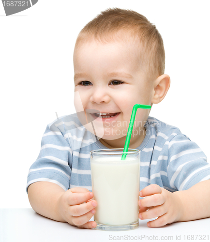 Image of Cute little boy with a glass of milk