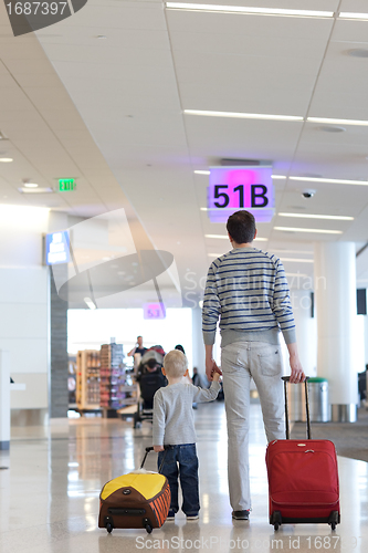 Image of father and son at the airport