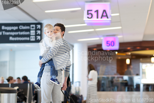 Image of father and son at the airport