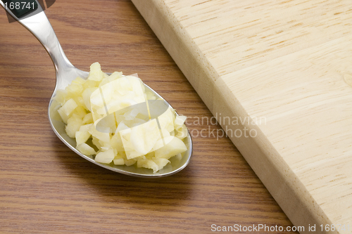 Image of Spoonful of chopped garlic

