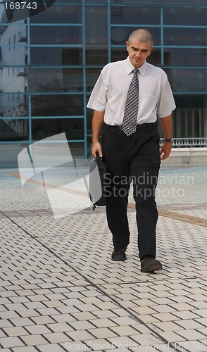 Image of Businessman walking