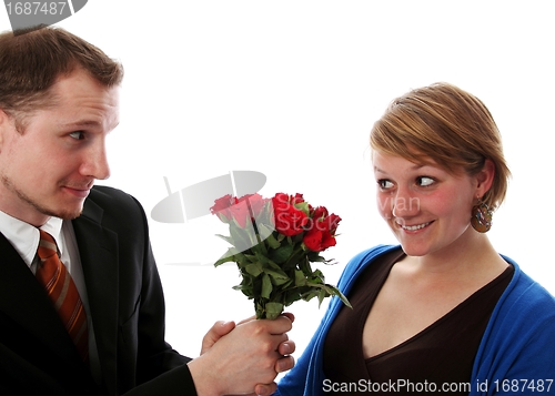 Image of Man gives a bunch of flowers to a women