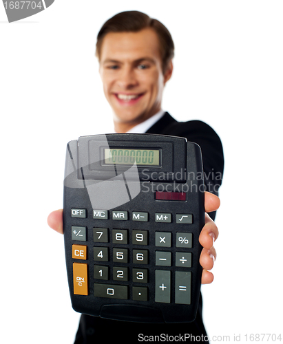 Image of Modern businessman showing calculator