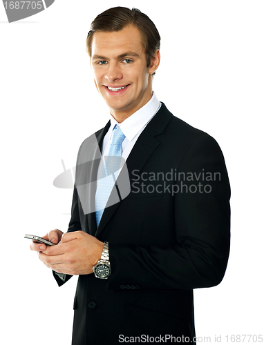 Image of Corporate man messaging from cellphone