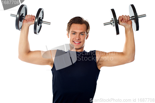 Image of Caucasian athlete exercising in sporty outfits