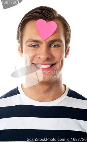 Image of Closeup of an attractive man with paper heart