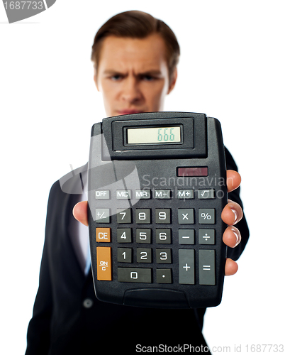 Image of Businessman holding a calculator