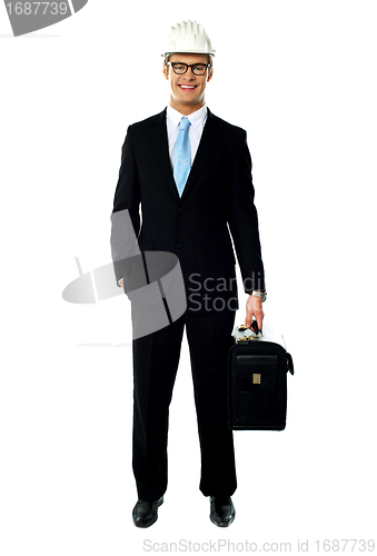 Image of Portrait of smiling young architect carrying briefcase