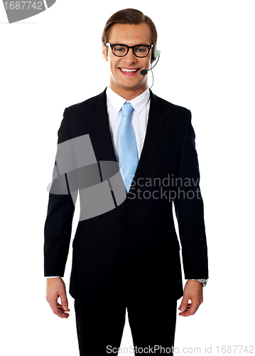 Image of Male telemarketer posing in headsets, smiling