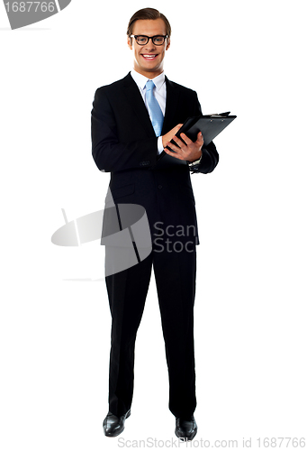 Image of Full length view of relaxed businessman holding a folder