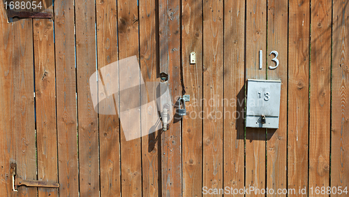 Image of wooden fence with a mailbox