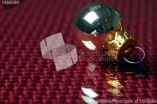 Image of golden christmas sphere reflection