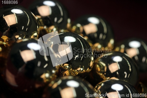 Image of golden christmas spheres reflection