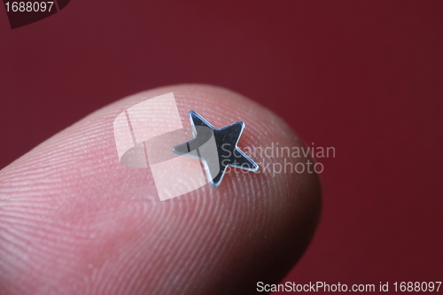 Image of little star on finger