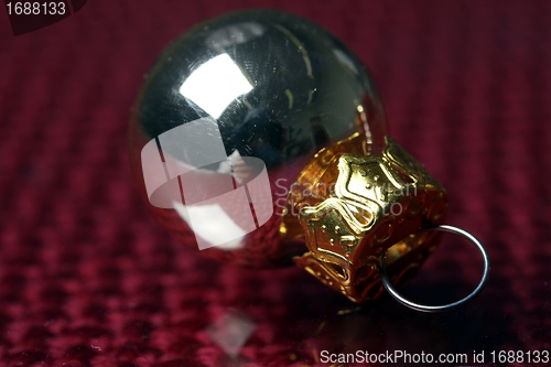 Image of golden christmas sphere reflection