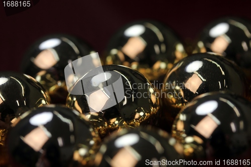 Image of golden christmas spheres reflection
