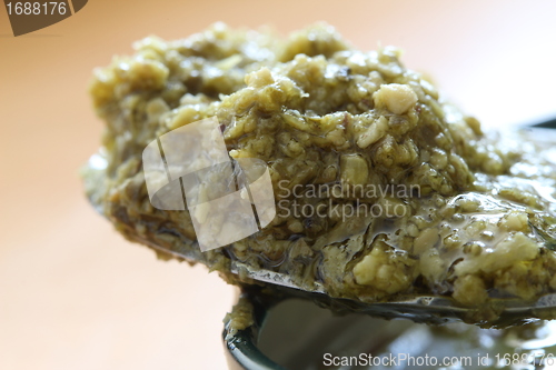 Image of green pesto spoon
