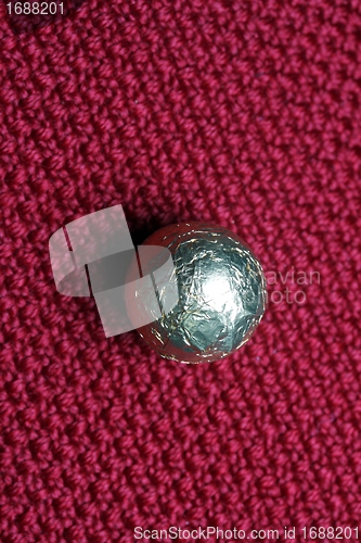 Image of shiny candy on carpet