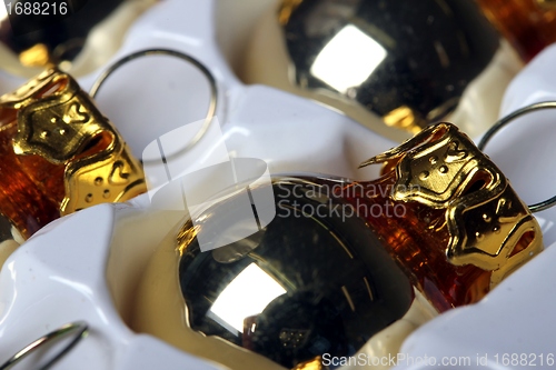 Image of golden christmas spheres reflection