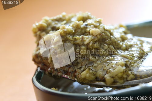 Image of green pesto spoon