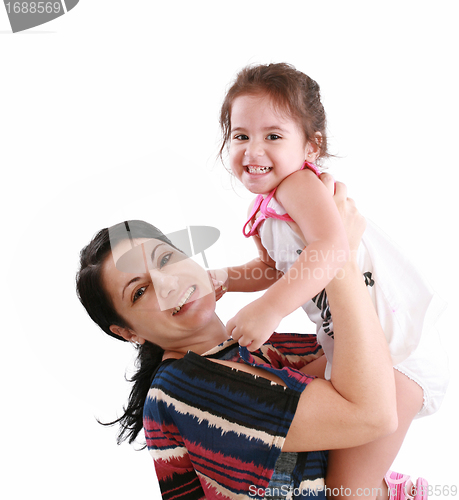 Image of little girl hugging to mother, in her arms 