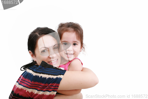 Image of beautiful young mother and her two year old daughter looking at 