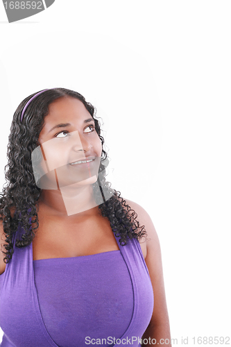 Image of smiling fat beautiful young woman looking up