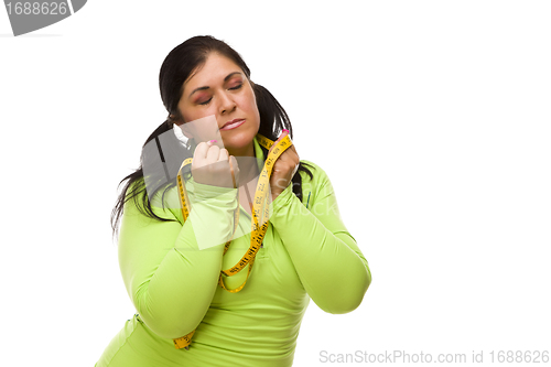 Image of Frustrated Hispanic Woman with Tape Measure