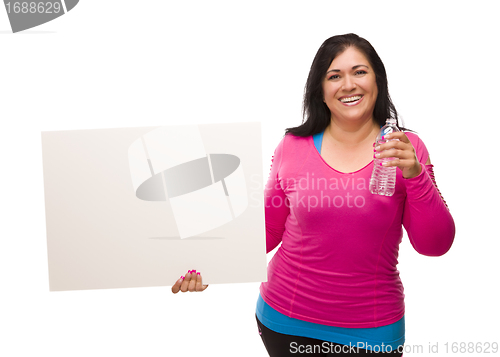 Image of  Hispanic Woman In Workout Clothes with Water and Blank Sign