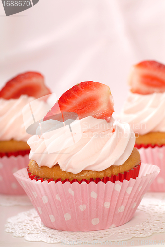 Image of Vanilla cupcakes with stawberry frosting and strawberries