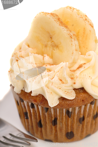 Image of Delicious carrot cake cupcake with cream cheese frosting, sliced