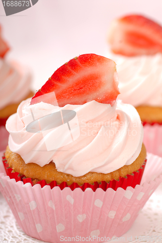 Image of Vanilla cupcake with stawberry frosting and strawberriy