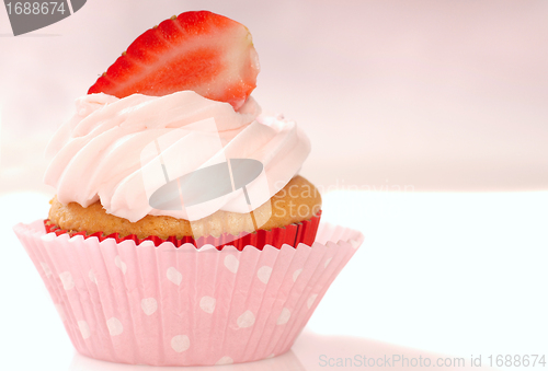 Image of Vanilla cupcake with stawberry frosting and strawberriy