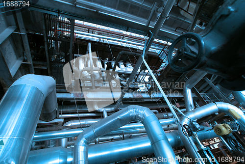 Image of Equipment, cables and piping as found inside of a modern industr