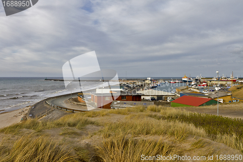 Image of coastline in north Denmark with houses and cloudy sky