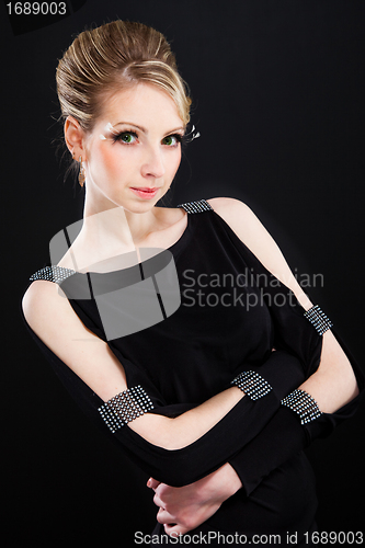 Image of beautiful woman in a fashionable black dress