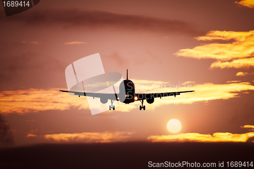 Image of plane in the sunset sky